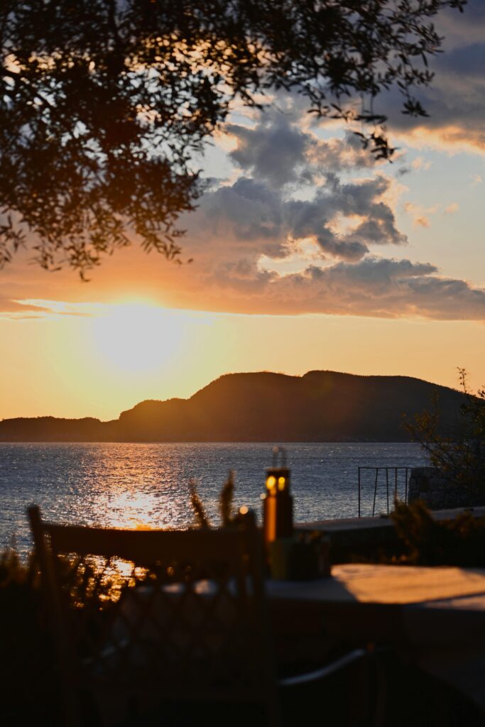Captivating sunset view over the calm Mediterranean Sea with a silhouette of distant islands.
